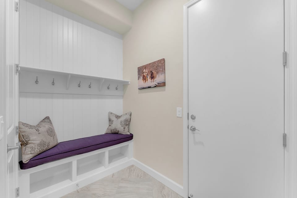 Walk in from the garage with bench to take your shoes off and store in cubby