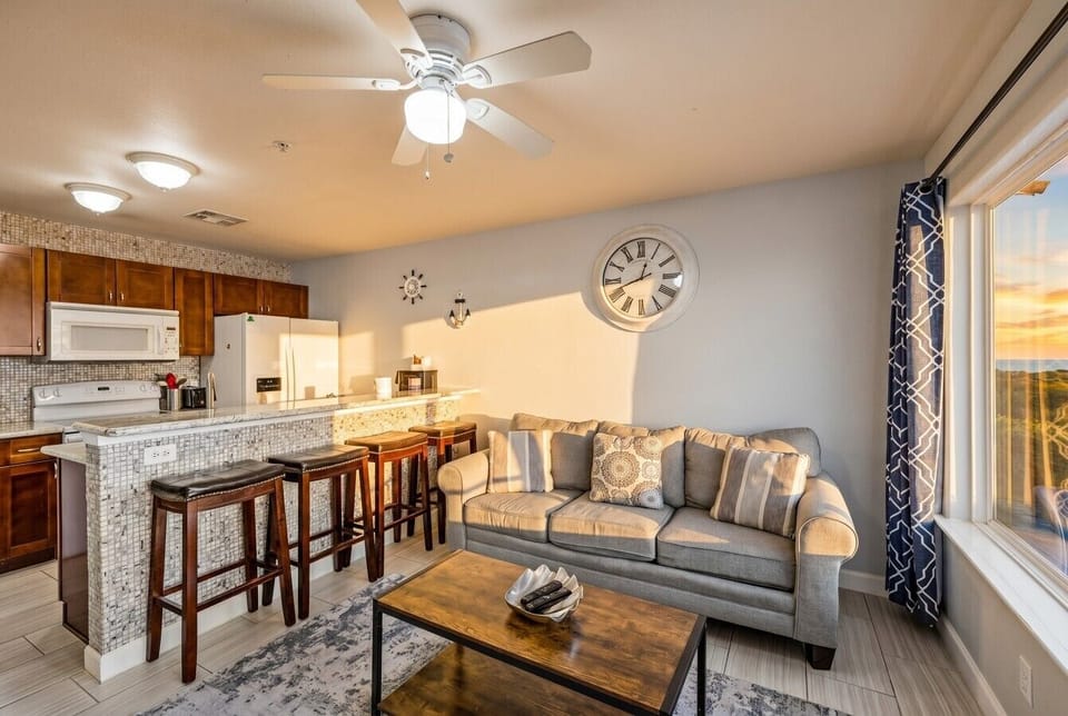 This is the main living room area of the home, connected to the kitchen bar seating