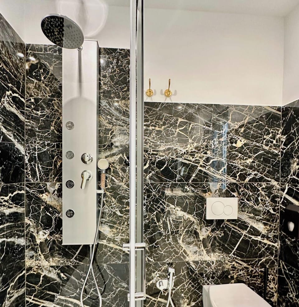 Double Room, Courtyard View | Bathroom | Shower, hair dryer, towels, soap