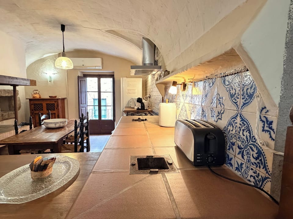 Savor your morning coffee before exploring the countryside of Girona.