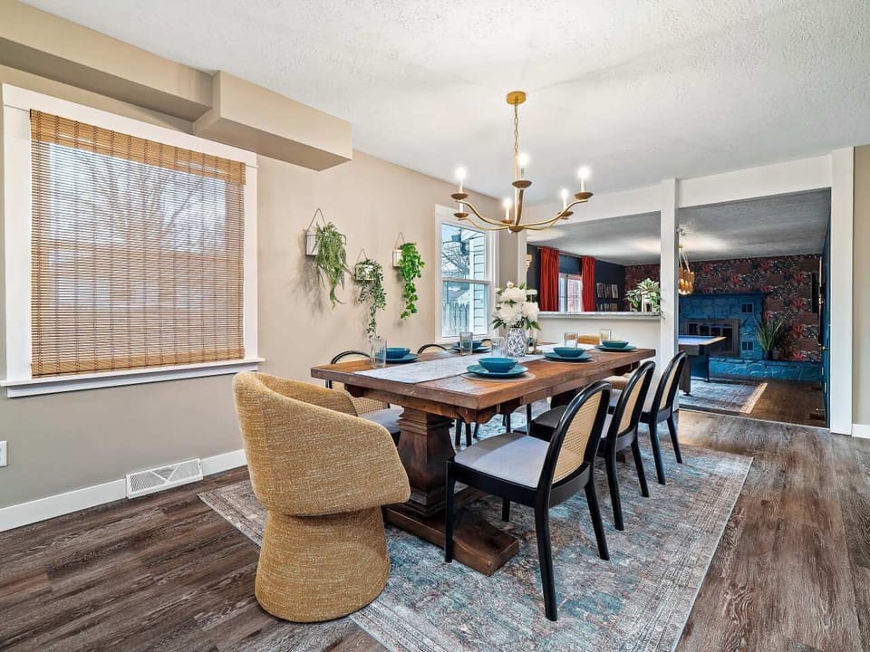 Gather around the large dining table, a bright space perfect for shared meals & conversation