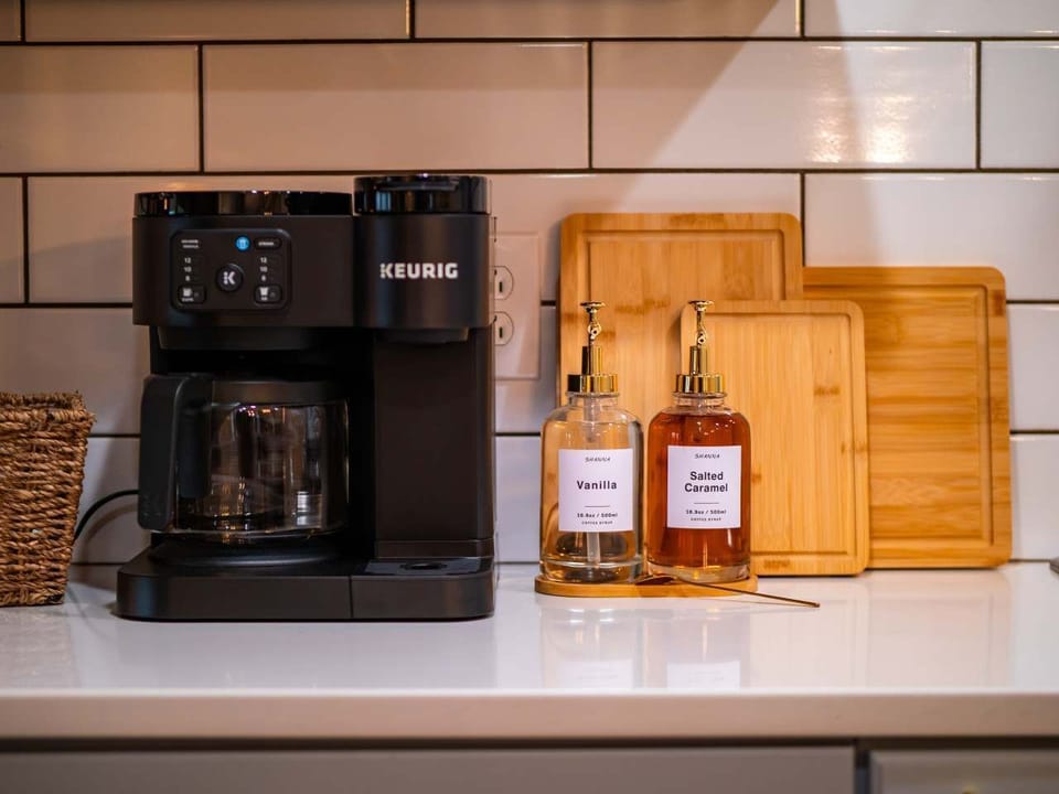 Start your morning right at the cozy coffee station w/ mugs & essentials within reach