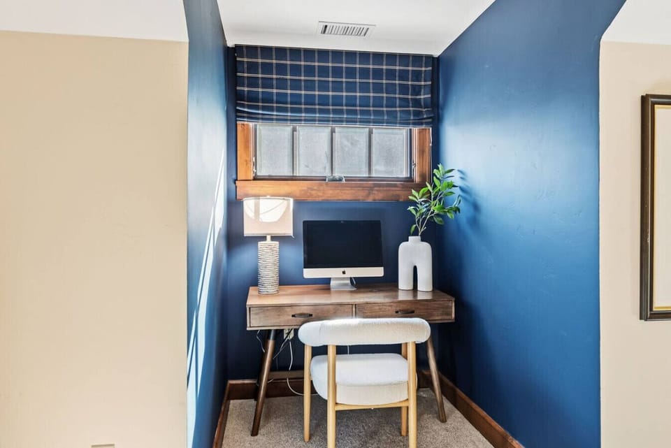King bedroom with en suite bathroom and workspace