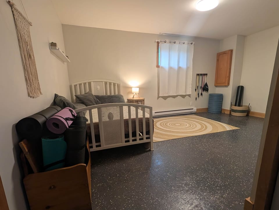 Lower level exercise space with Dbl bed