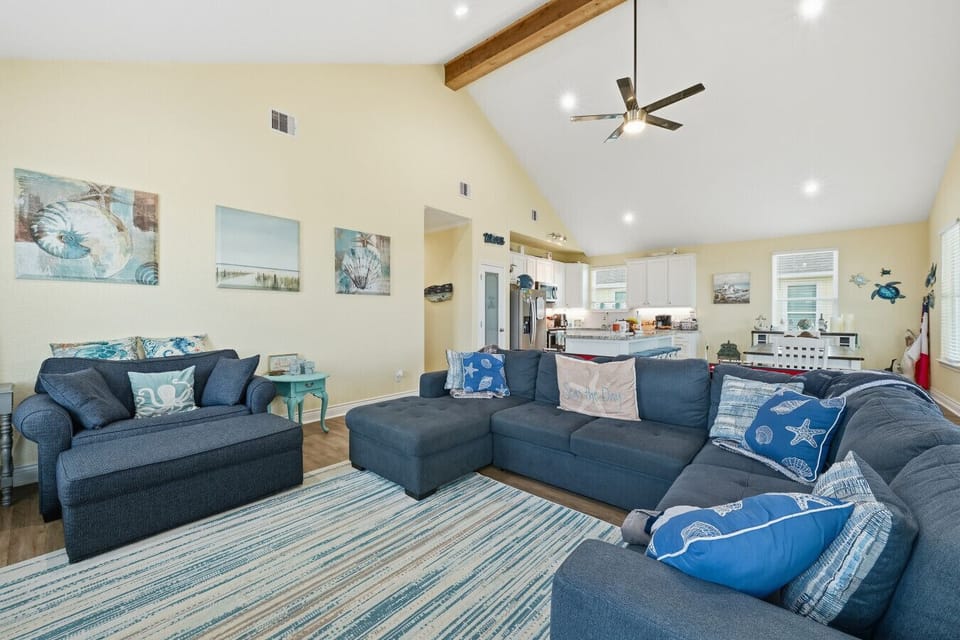 Living Room | Spacious Open-concept Layout with Vaulted Ceilings, Sectional Sofa, and Natural Light