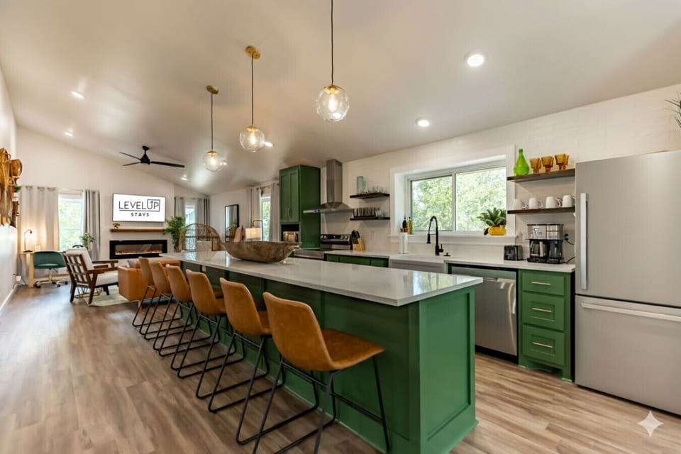 Gather around the stylish kitchen island — perfect for morning coffee or pre-dinner drinks