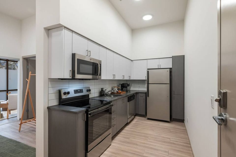 Fully equipped modern kitchen with stainless steel appliances — perfect for cooking your favorite meals during your stay.