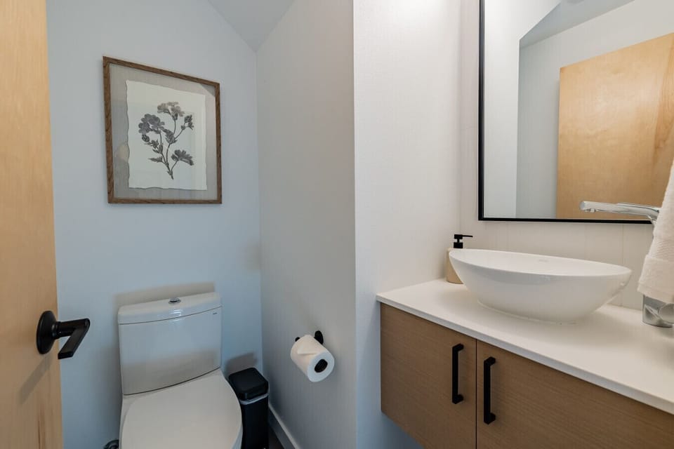 First floor half-bathroom with toiletries and essentials provided.