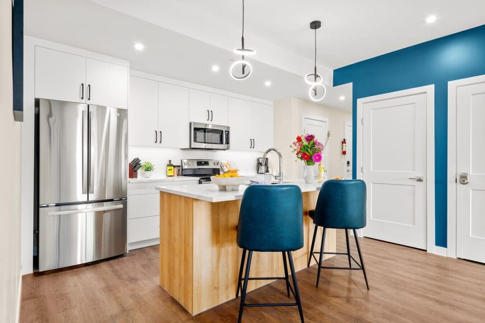 The modern kitchen is equipped with modern appliances and basic essentials.