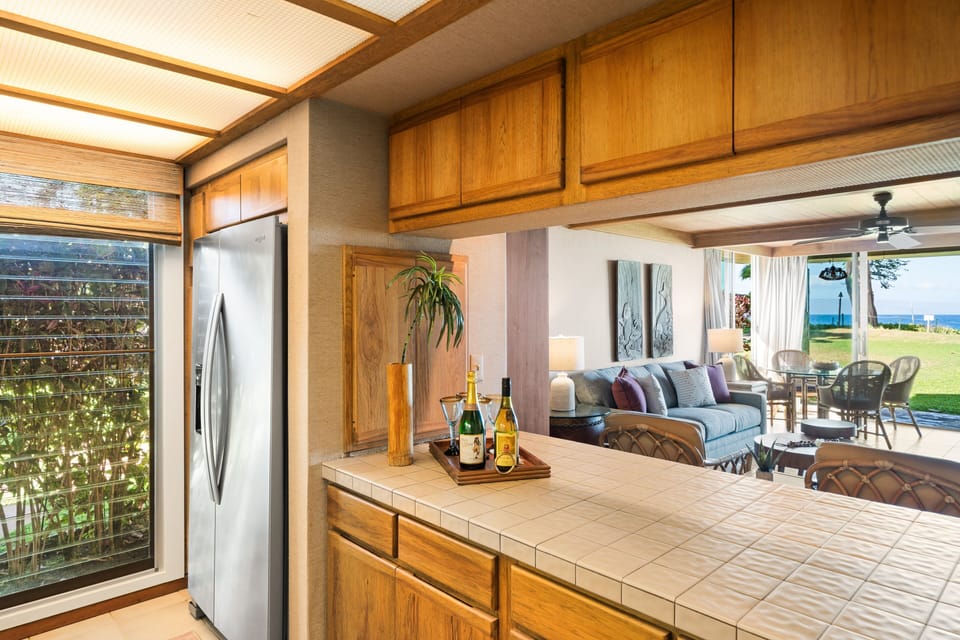 Open kitchen design with a serving bar overlooking the living room