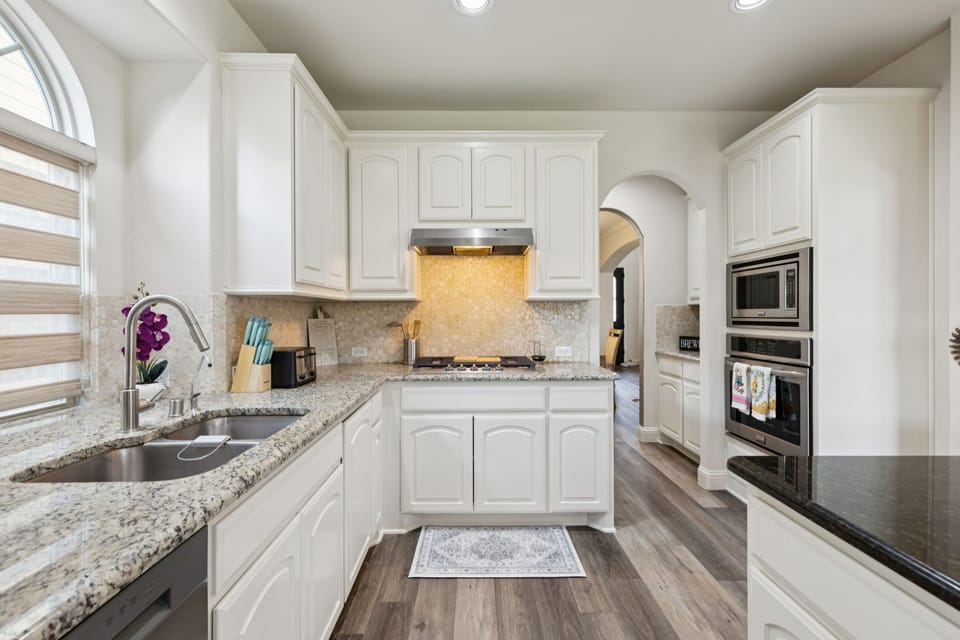 Gourmet Kitchen: Fully equipped with granite counters and stainless appliances.