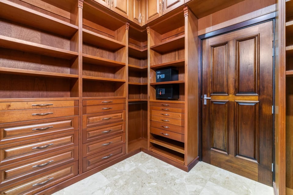 Our expansive custom walk-in closet offers generous shelving, numerous drawers, and even safes to secure your valuables. With this much space, you can truly settle in and enjoy your stay without a wrinkle in sight.