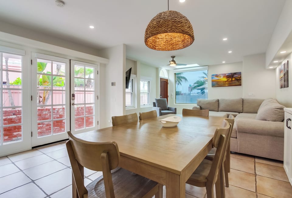 Enjoy meals together at a dining table with seating for six.