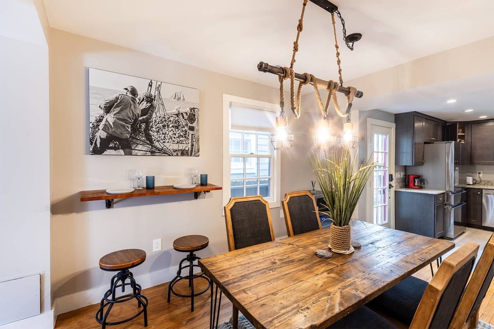 The photo above the convertible table is an homage to the original owner of the home, an oyster fisherman.