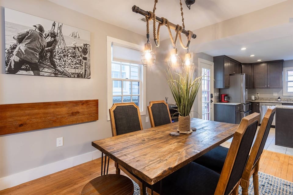 The dining room table anchors the historic home and has seating for 6.