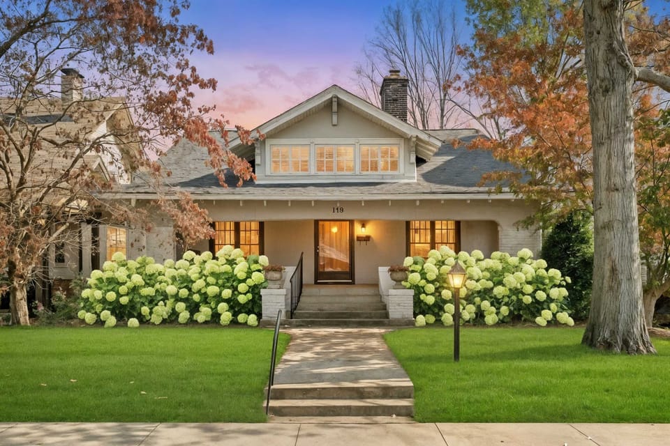 Pull up after a day of tastings and know you're home — porch lights on, hydrangeas framing the walk, a quiet street that doesn't feel like a rental block.