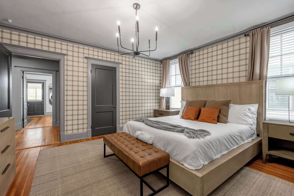 Finally get a king bed to yourself for the night — sink in, stretch out, and let you sleep past everyone else nursing bourbon from the evening before.