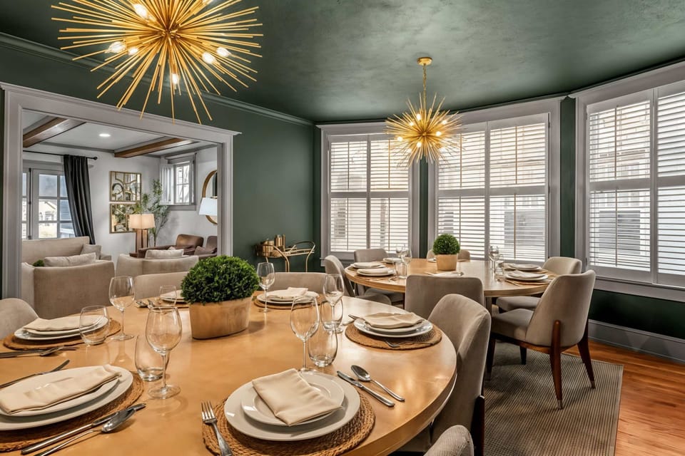 You'll split into two tables when the whole group sits down together — wine glasses already out, room enough for the entire crew at once.