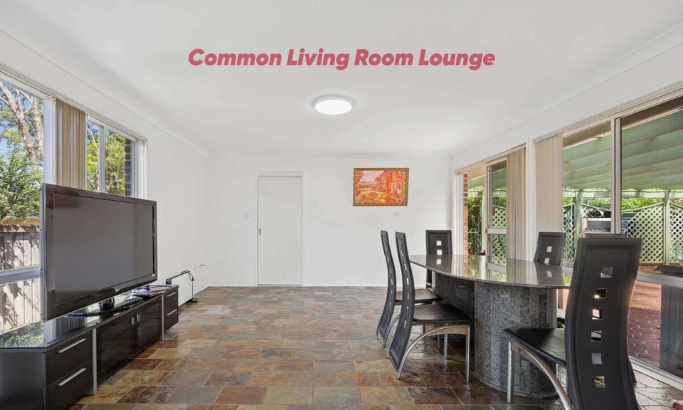 Common living and dining area with TV, dining table, and open-plan layout