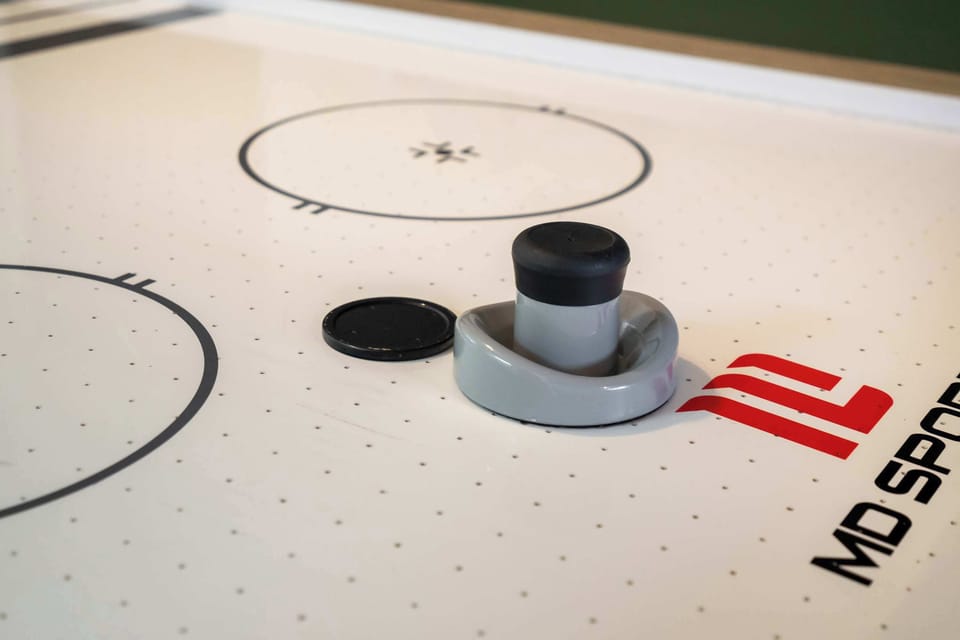 A close-up look at the air hockey table highlights one of the home’s most entertaining features.