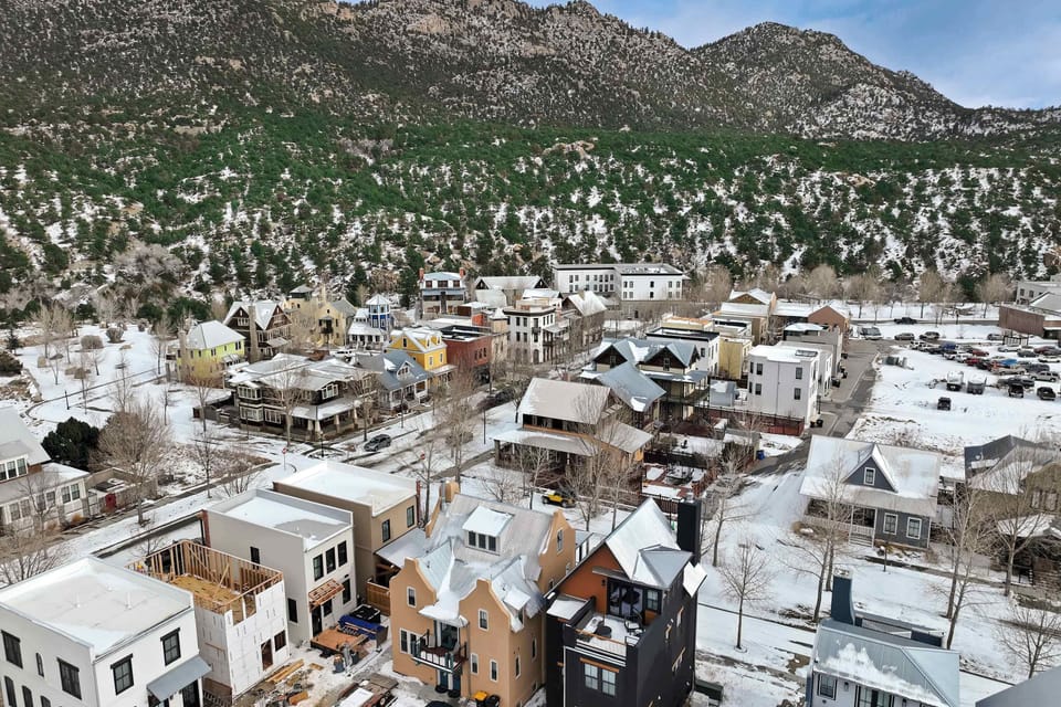 This elevated view shows South Main nestled right against the foothills, blending modern homes with rugged natural terrain. It highlights how the neighborhood offers both a vibrant community setting and immediate access to the outdoors.
