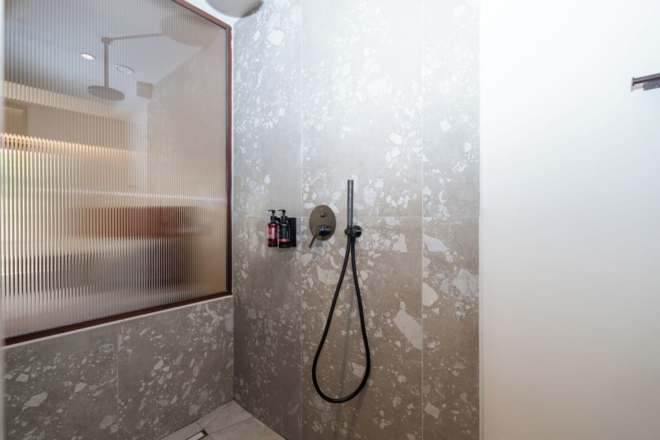 Junior Suite, Garden View | Bathroom | Shower, hair dryer, bathrobes, slippers
