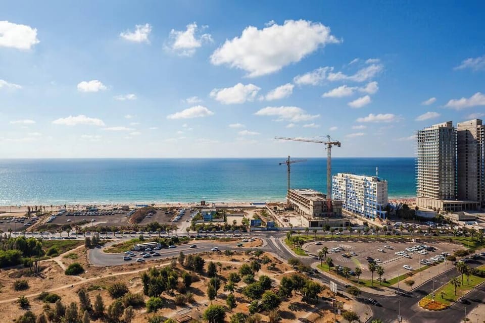 Panoramic sea view stretches endlessly, placing you moments from beach walks, shops, and vibrant surroundings.