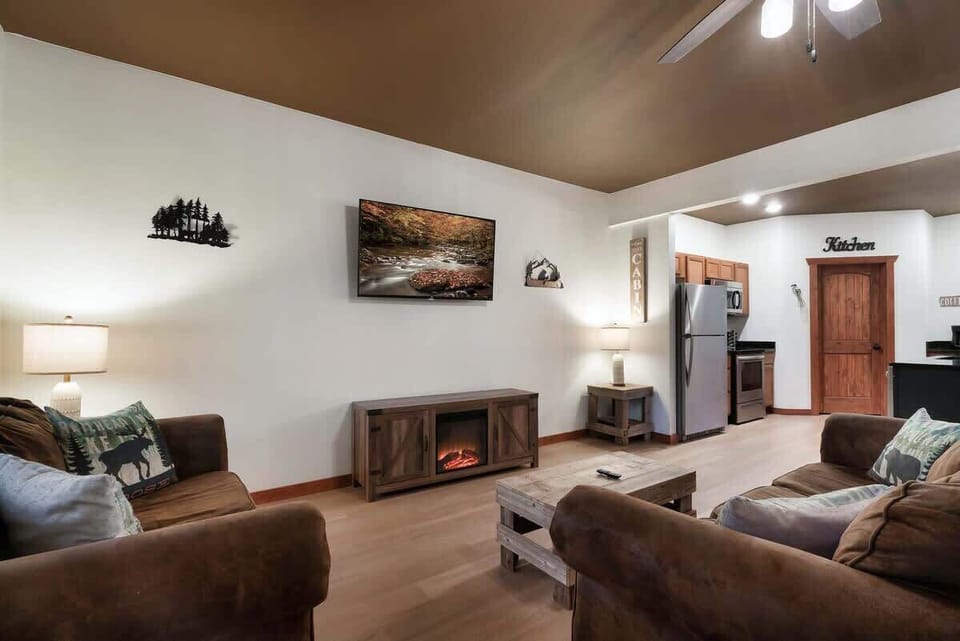 Experience vibrant mountain vibes with a fireplace and stunning art decor!