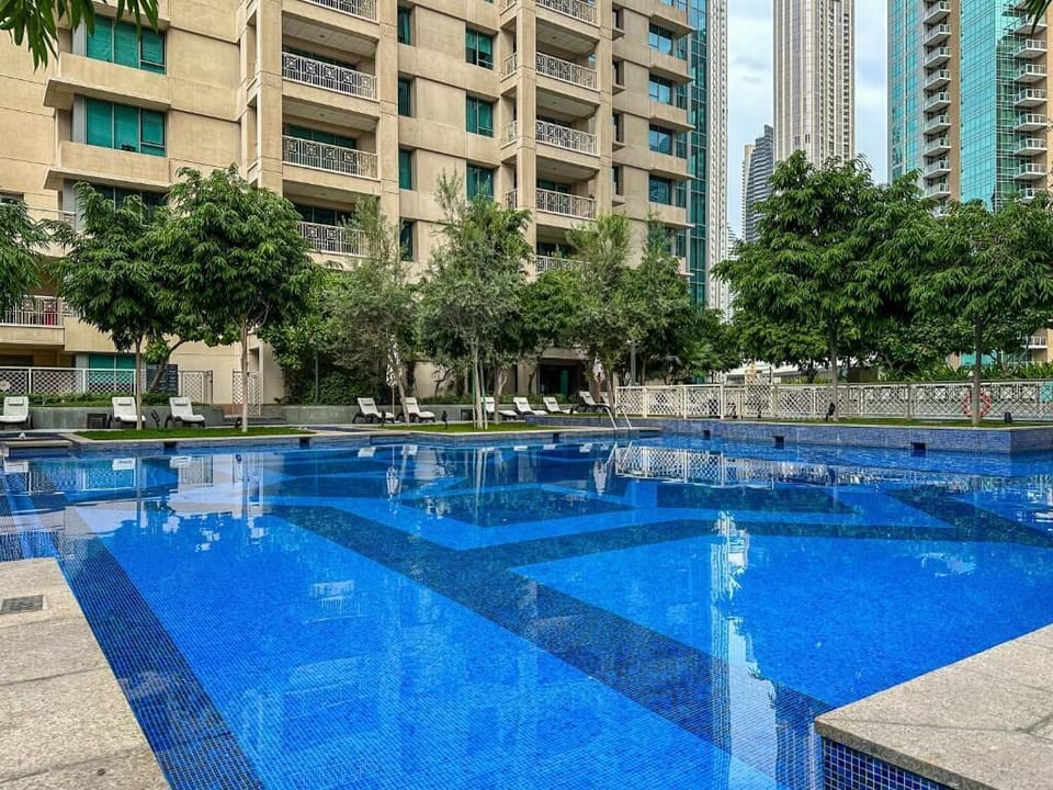 Outdoor pool, pool umbrellas, sun loungers