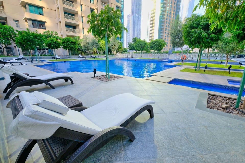 Outdoor pool, pool umbrellas, sun loungers