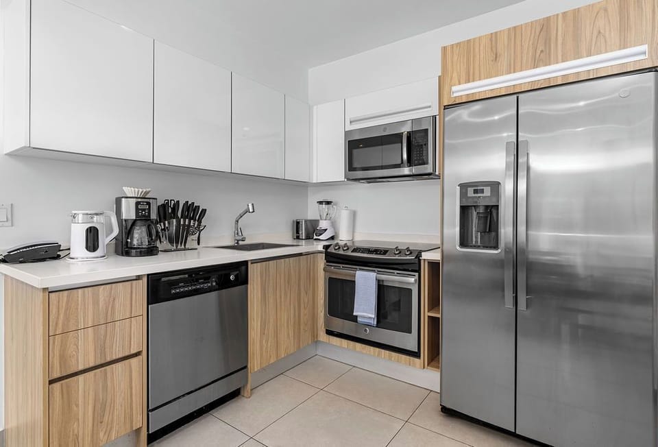 Enjoy a bright, modern bathroom with a spacious walk-in shower, large vanity, and elegant finishes designed for your comfort and convenience.