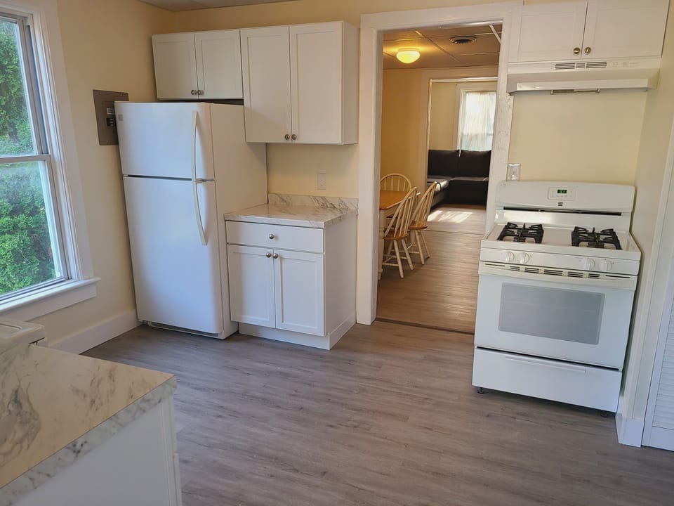 Kitchen with dining room and living room beyond