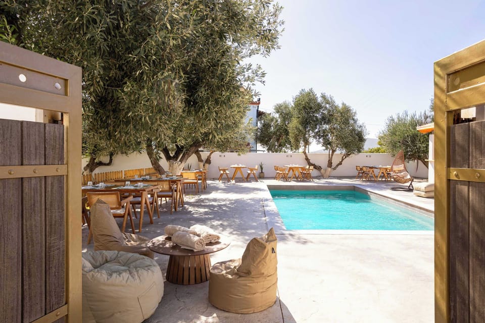 Pool Terrace with Olive Trees and Rustic Lounge Decor
Beautiful pool area with clay pots, shade, and stone pathways.