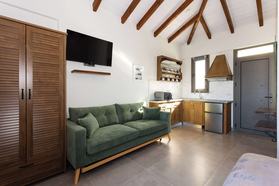 Living Room with High Ceilings and Direct Outdoor Access
Comfortable seating area with natural light and garden-facing doors.