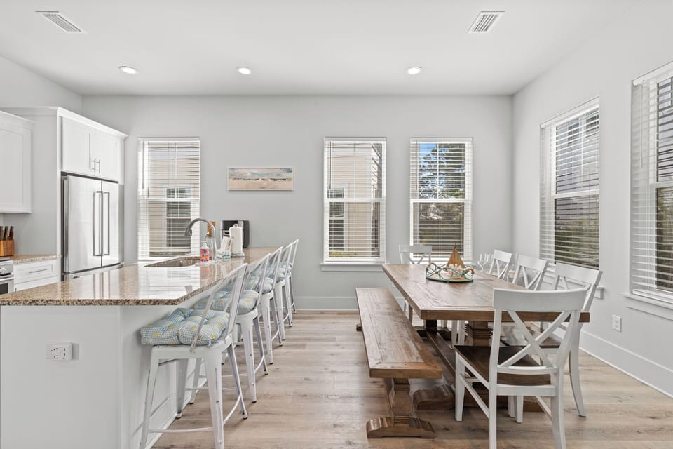 Gather around this bright, open kitchen and dining space where your group can cook together and share meals at the beautiful farmhouse table.