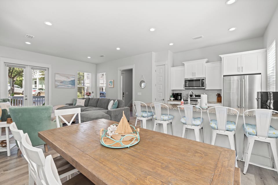 Gather around your spacious dining table while savoring ocean views through bright windows, then relax in the cozy living room.