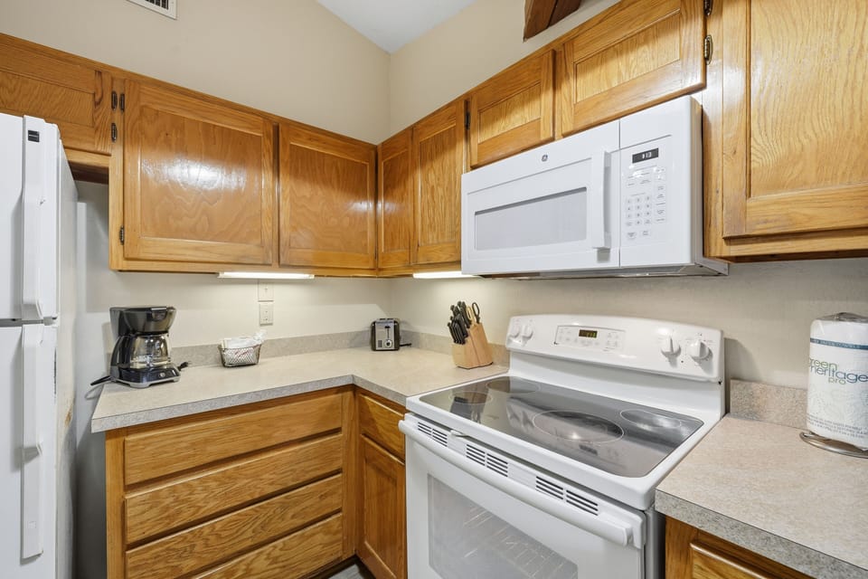 Start your mornings right with coffee brewed in this charming kitchen corner, perfectly positioned for making memories by the sea.