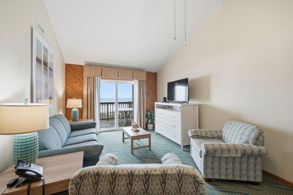 Enjoy ocean breezes in this welcoming space, with large windows providing a picturesque view of the coast.