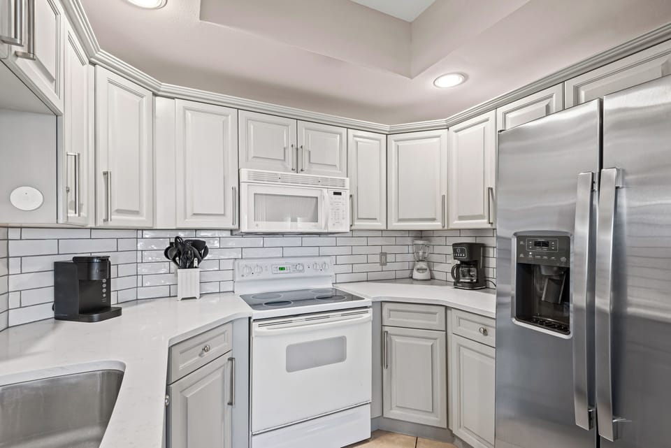 Kitchen with tiled backsplash.