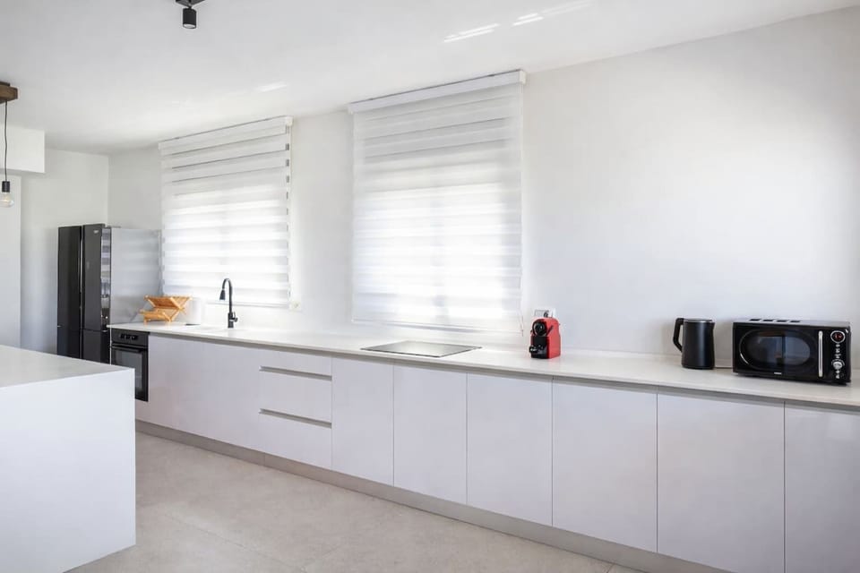 Prepare meals in the modern kitchen before heading out to explore the central Tel Aviv neighborhood.