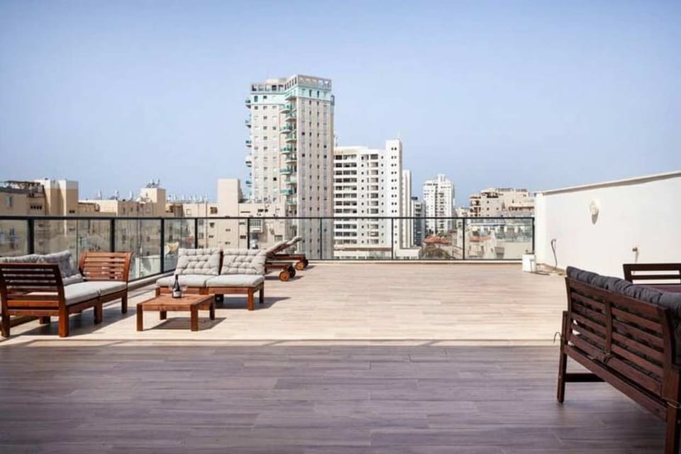 Expansive rooftop terrace offers sunshine, skyline views, and plenty of space for relaxed outdoor moments.