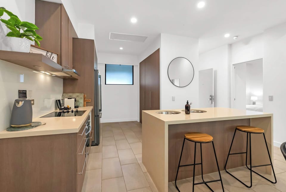 Pull up a stool at the breakfast bar for morning coffee, casual bites or a chat while meals come together in the kitchen.