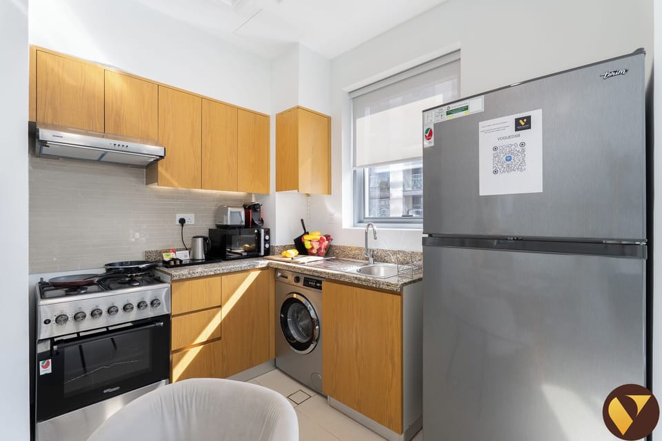 Luxury Apartment, City View | Private kitchen | Full-size fridge, microwave, oven, stovetop