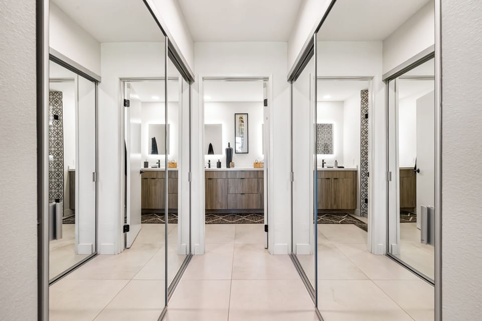 Dual Closets in Primary Bedroom leading to primary bathroom