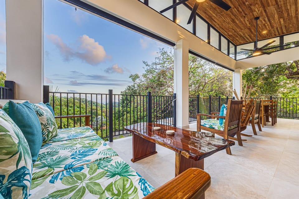 Open-air dining on the upper terrace overlooking the jungle
