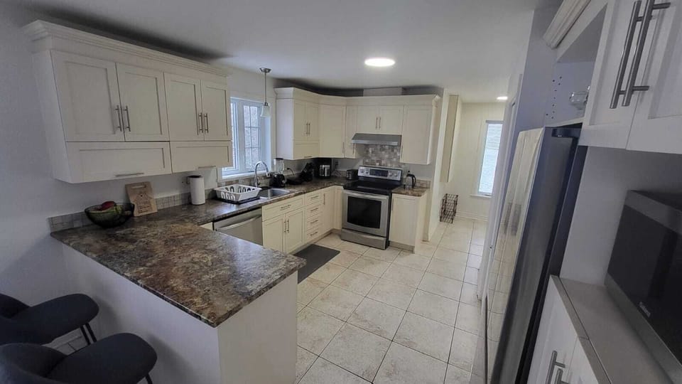 Full kitchen with dishwasher, kettle, portable french press, and more