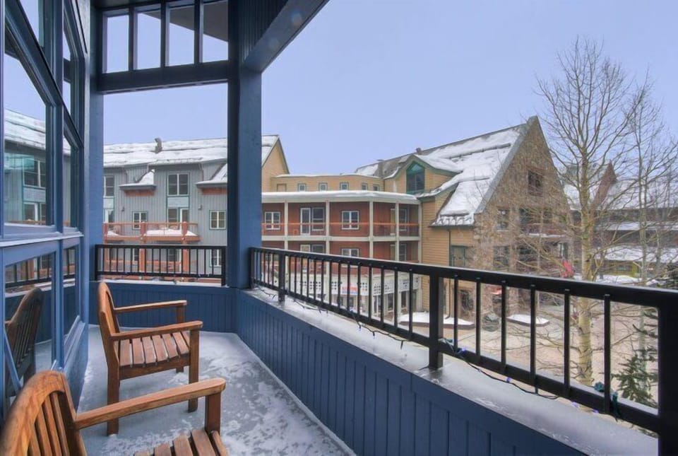 Enjoy the outdoor views from the private balcony, creating a serene space for morning coffee or evening relaxation amidst the snowy landscape.