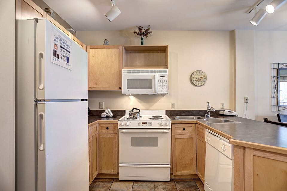This well-equipped kitchen boasts modern appliances and ample cabinetry for all your cooking needs.