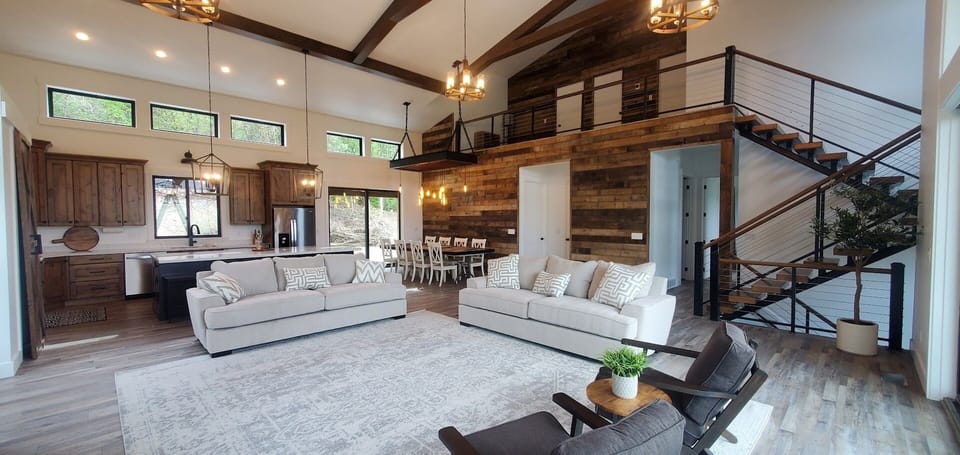 Spacious family room and open kitchen with stunning floor-to-ceiling mtn views.