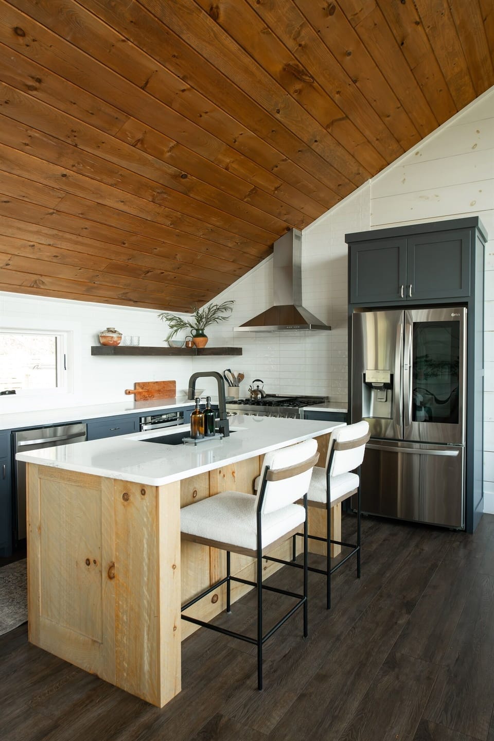 Kitchen | Custom wood island beneath soaring vaulted ceilings